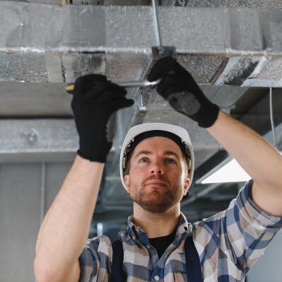 technician installing commercial hvac ductwork